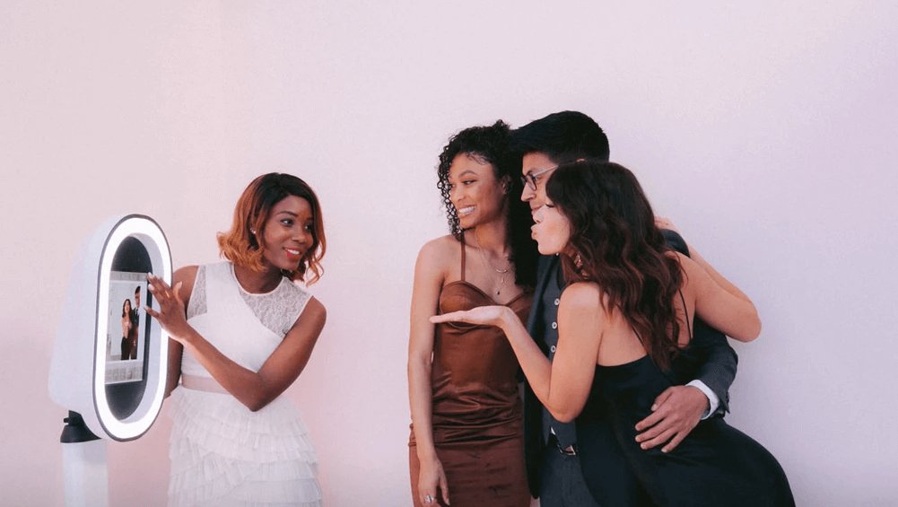 group taking a photo at a photo booth at an event