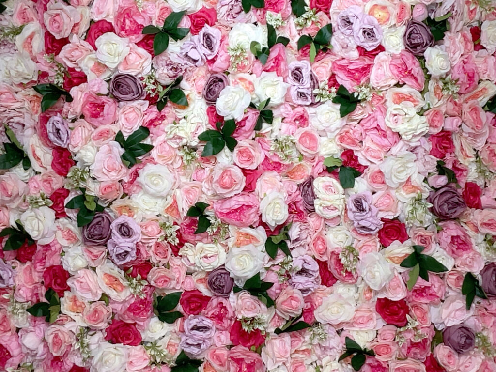 Unique pink floral backdrop for a photo booth