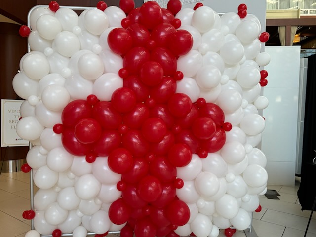 White square balloon wall with red cross in center