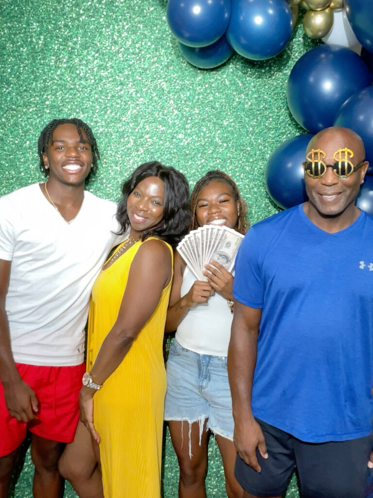 Guests with props on a photo booth