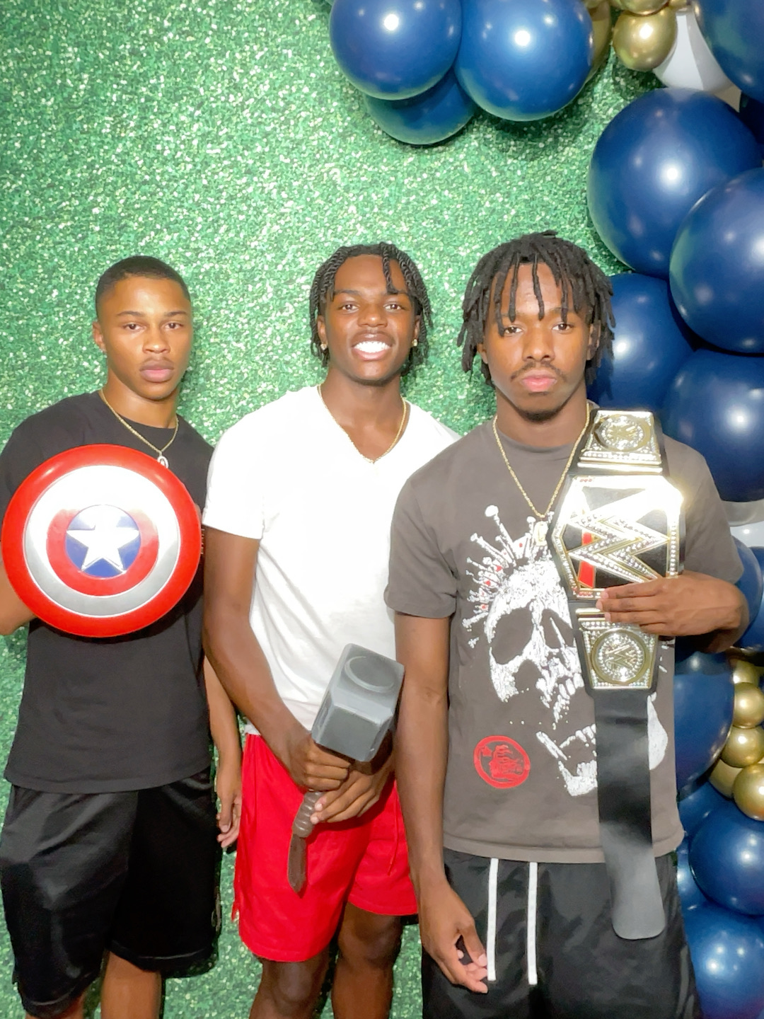 group of kids in front of backdrop at graduation party