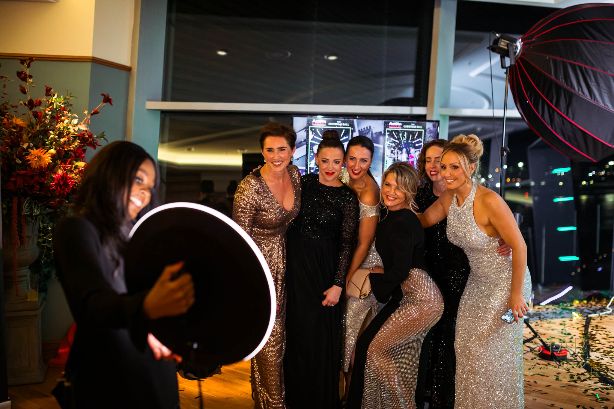 group of people taking a photo at a gala