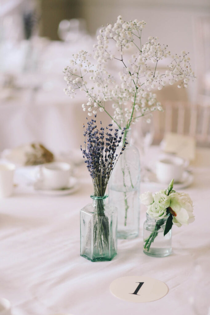 lavender and baby’s breath in vintage glass vases