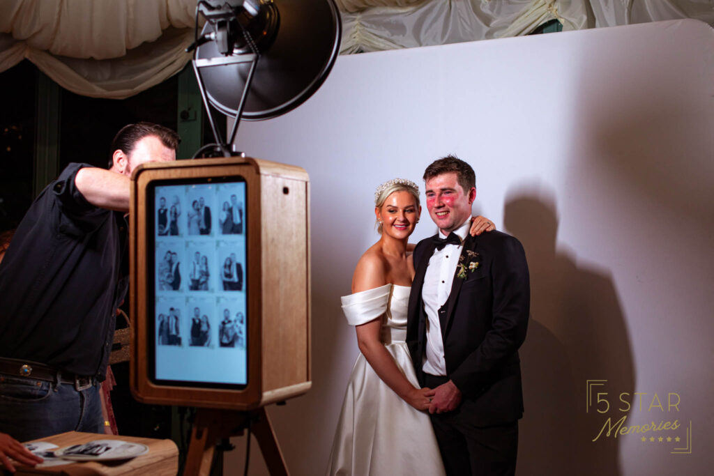 The Bride and Groom getting ready to have their photo taken on the photo booth